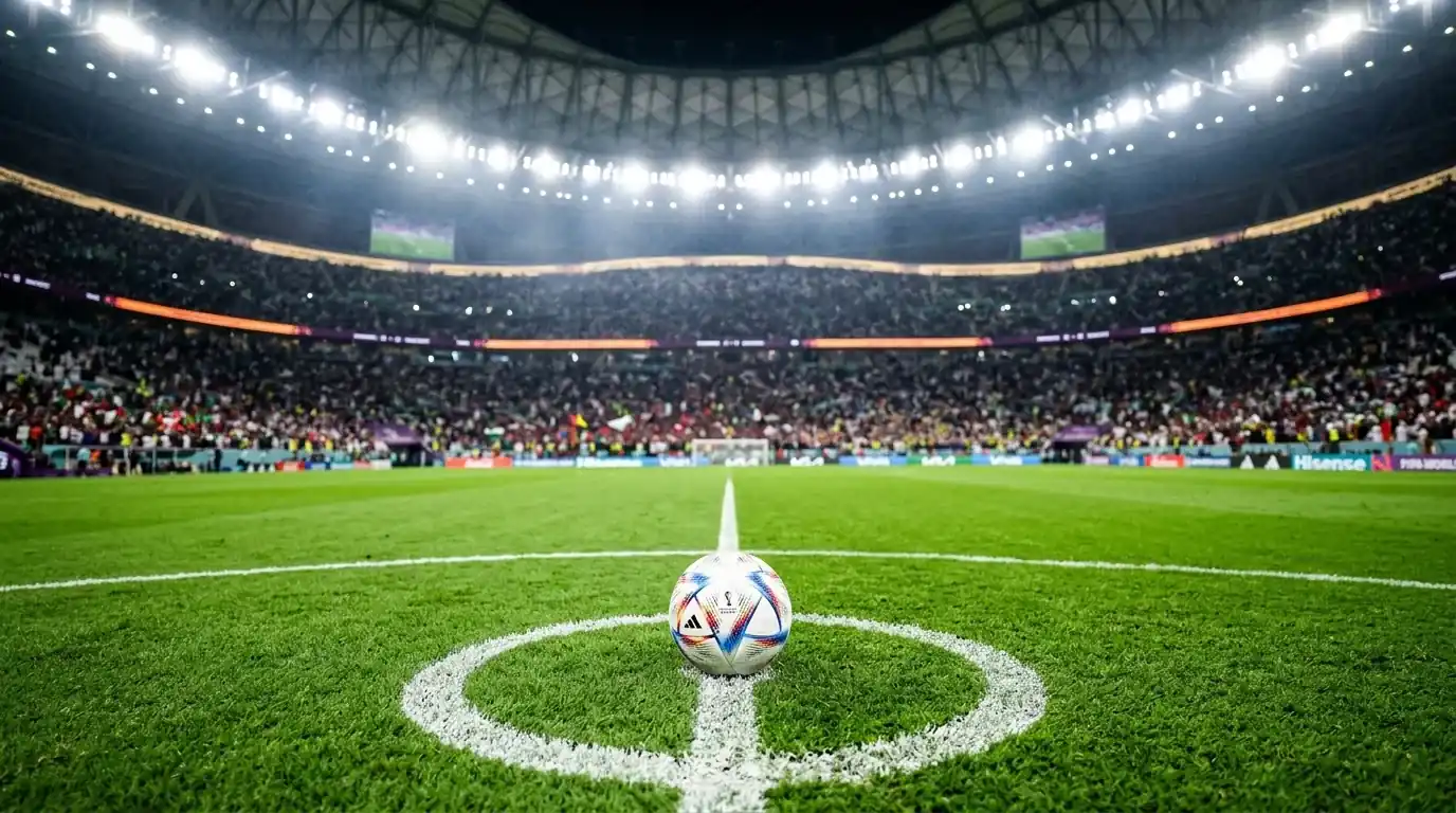 Match ball on the centre spot of a floodlit World Cup pitch before kick-off